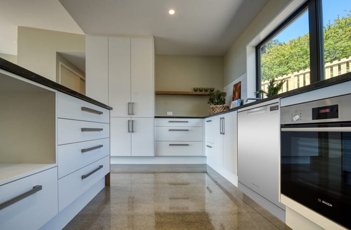 Galley kitchen with polished concrete floor
